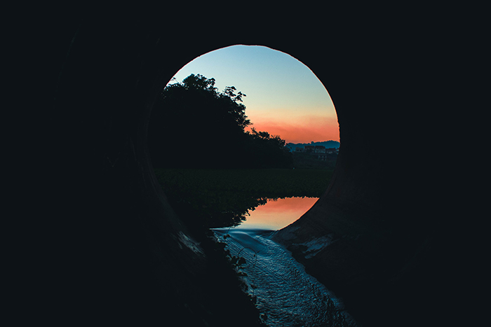 Looking out of a concrete culvert